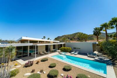 Photo 1: desert garden and pool by day